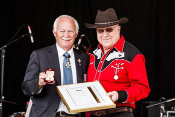 Commissioner of Yukon Doug Phillips presents longtime Yukon musician Hank Karr with a Commissioner’s Award for Public Service at the Canada Day ceremonies.
