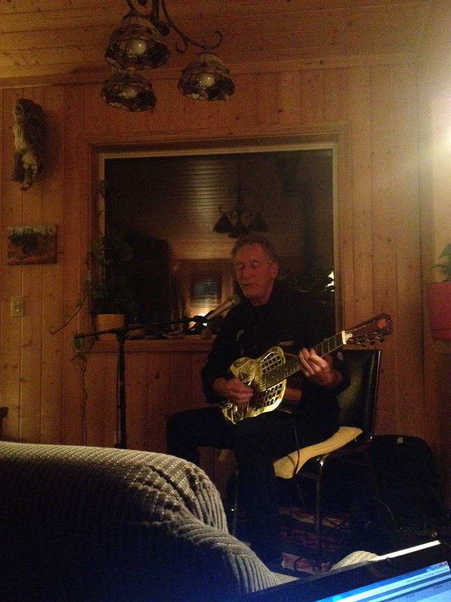 Terry Gillespie performing at a house concert in Haines Junction, Yukon in October 2015.